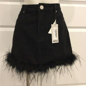 Black denim mini skirt feather hem